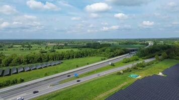 Drone view of a highway in Germany with a lot of traffic and many green fields around it. photo
