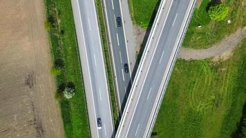 Drone view of a highway in Germany with a lot of traffic and many green fields around it. photo