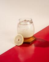 Lemon honey ice is a mixture of mineral water with lemon juice and honey photo