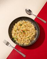 Salted fish fried rice is a dish of rice fried in a pan which produces a different taste because it is mixed with spices and salted fish. photo