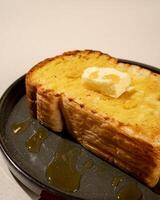 Roti burn is a typical grilled Indonesian sandwich, consisting of two slices of bread and a filling of honey and butter photo