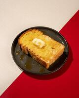 Roti burn is a typical grilled Indonesian sandwich, consisting of two slices of bread and a filling of honey and butter photo