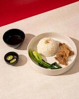 Beefsteak is processed beef that goes through a grilling process until the meat is cooked inside and out, served with warm sauce and rice photo