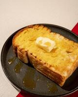 Roti burn is a typical grilled Indonesian sandwich, consisting of two slices of bread and a filling of honey and butter photo