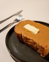 Roti burn is a typical grilled Indonesian sandwich, consisting of two slices of bread and peanut butter filling photo