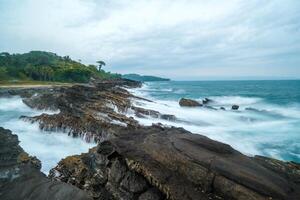 seascape is very beautiful with coral rocks and sea water that looks very soft like cotton. slow shutter speed effect photo