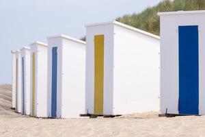 Colorful changing cabins on the beach photo