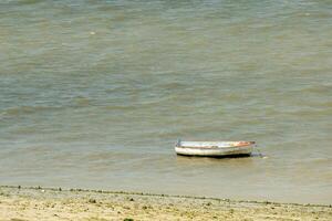 old rowing boat on the coast photo