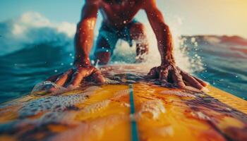 Surfer riding the waves on a sunny day, close-up of hands on the surfboard, enjoying the thrill and adventure of surfing. photo