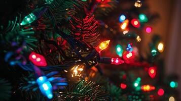 Close-up of colorful Christmas lights on a fir tree branch, creating a festive and warm holiday atmosphere. photo