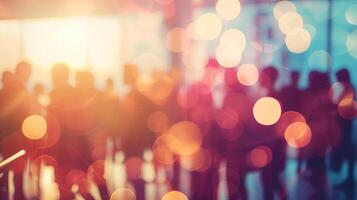 Blurry abstract image of people at an event with colorful bokeh lights. Perfect for business or lifestyle themes and background usage. photo