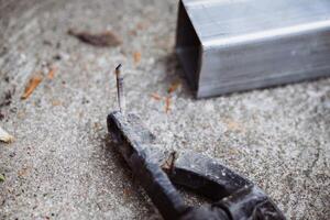 Welding wire that is about to run out Unsafely placed. Dangerous. Do not continue use. Working without safety standards. photo