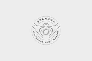 Minimalist human hands holding camera lens shutter circle line art logo with place for text vector