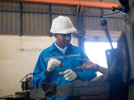 White hardhat helmet safety uniform factory work job occupation maintenance engineer industry construction foreman architect builder professional pointing finger cheerful look construction project photo