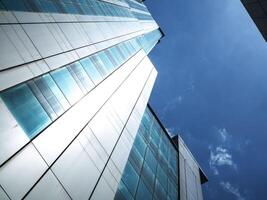 Building tower blue sky top view copy space skyscraper modern business urban outdoor office exterior construction downtown futuristic financial structure corporate building industry travel low angle photo