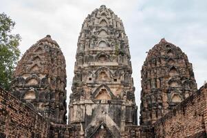 The three prangs in Wat Si Sawai temple one of the oldest temples in Sukhothai. Wat Si Sawai initially started off as a Hindu temple during the Khmer period. photo