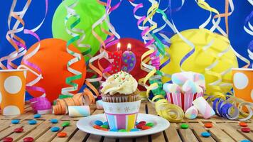 Birthday 79 cupcake with candles burning on rustic wooden table with background of colorful balloons, plastic cups and candies with blue wall in the background photo