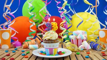 Birthday 93 cupcake with candles burning on rustic wooden table with background of colorful balloons, plastic cups and candies with blue wall in the background photo
