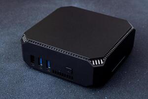 A small system unit of a personal computer. Compact device. photo