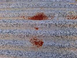 Close-up of rust on an old galvanized sheet. photo