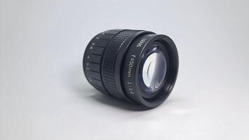 a lens with a white background and a black lens photo