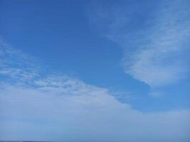 a view of the ocean and sky from a beach photo
