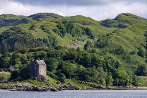 DUNTRUNE, ARGYLL and BUTE, SCOTLAND, UK, MAY 30. View of the castle in Duntrune in Argyll and Bute, Scotland on May 30, 2024 photo