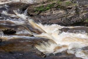 View of the Falls of Dochart in Killin, Scotland on a spring day photo