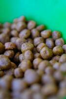 Photography of Texture of cat food grains. Textured background of round, brown cat food. Graphic Resources. Details and textures. Food photography. Shot in macro lens photo