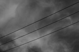 Black and white photography of three parallel electrical cables. Monochrome of exterior on public park. Graphic Resources. Monochrome Background Photography. Light Shadow Photography Concept. photo