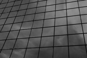 Black and white iron fence with rectangular weave. Monochrome of exterior on public park. Graphic Resources. Monochrome Background Photography. Light Shadow Photography Concept. photo