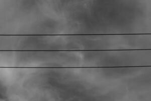 Black and white photography of three parallel electrical cables. Monochrome of exterior on public park. Graphic Resources. Monochrome Background Photography. Light Shadow Photography Concept. photo