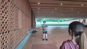 Men and women play basketball alone in public areas for fun and practice at the same time. video
