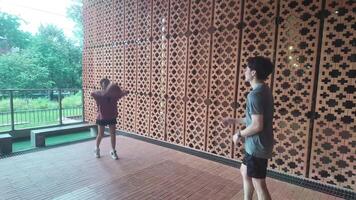 Men and women play basketball alone in public areas for fun and practice at the same time. video