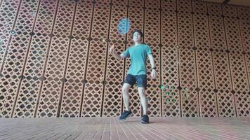 A man plays basketball alone in a public area, having fun and practicing at the same time. video