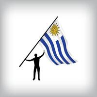 A man holds the flag of URUGUAY in the air. flag waving. National day realistic flag vector