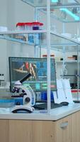 Empty laboratory modernly equipped with nobody in it, prepared for pharmaceutical innovation using high tech and microbiology tools for scientific research. Vaccine development against covid19 virus. photo