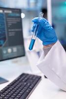 Closeup of test tubes for science experiment. Research of medical scientist chemist doctor discovery scientific disease with professional equipment in modern laboratory photo