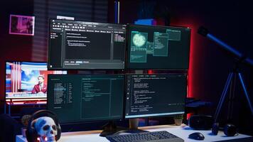 Script running on computer in secret base of operations used by hacker to steal data. Programming language on screen in empty room used by cybercriminal, attacking firewalls photo