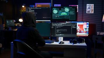 Happy man writing code on PC, celebrating after managing to get past security systems. Hacker using computer to make scripts that can hack devices, feeling proud after breaching firewall, camera B photo