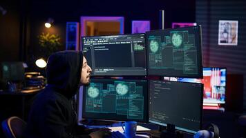 Hacker happy after successfully penetrating firewalls using malware, seeing access granted notification. Rogue programmer successfully gaining access to victim data, camera B photo