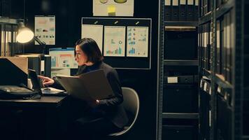 Private agent working in archive room at police to read official records or documents relevant to criminal case investigation. Detective officer conducting background check on suspects. Camera A. photo