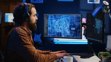 Developer updating artificial intelligence neural networks, drinking coffee and listening music in personal office. IT expert enjoying hot beverage and audio podcasts while writing AI code, camera A photo