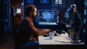 Computer scientist writes code on PC to visualize artificial intelligence neural networks. Remote IT worker runs AI script for information processing from personal office, camera B photo