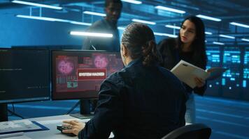 Admin in server hub panicked by valuable data threatened by hacking attack on computers. Scared coworkers failing to safeguarding data center against unauthorized access and vulnerabilities photo