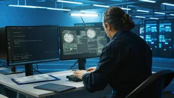 System administrator in server room frightened by sensitive data threatened by hacking attack on computers. Afraid man jumping out of desk chair, rushing to save data center from unauthorized access photo