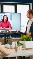 Diverse business team having videomeeting discussing online with remotely executive manager in business office. Remote call , coworker teamwork online brainstorm, startup office company photo