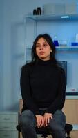 Wired patient waiting scientist doctor in neurological research laboratory visiting scientists examining tomography scan. Woman sitting in lab equipped for development of experiments photo