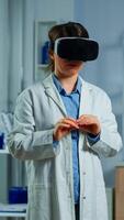 Advanced neurological scientist using medical inovation in lab wearing virtual reality glasses, gesticulating. Team of researchers working with equipment device, future, medicine, healthcare, vision, simulator photo