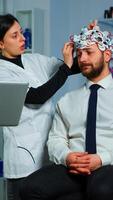 Women team neurological researchers working together developing treatment for diagnosis of braindisease, explaning eeg results, health status, brain functions, nervous system and tomography scan photo